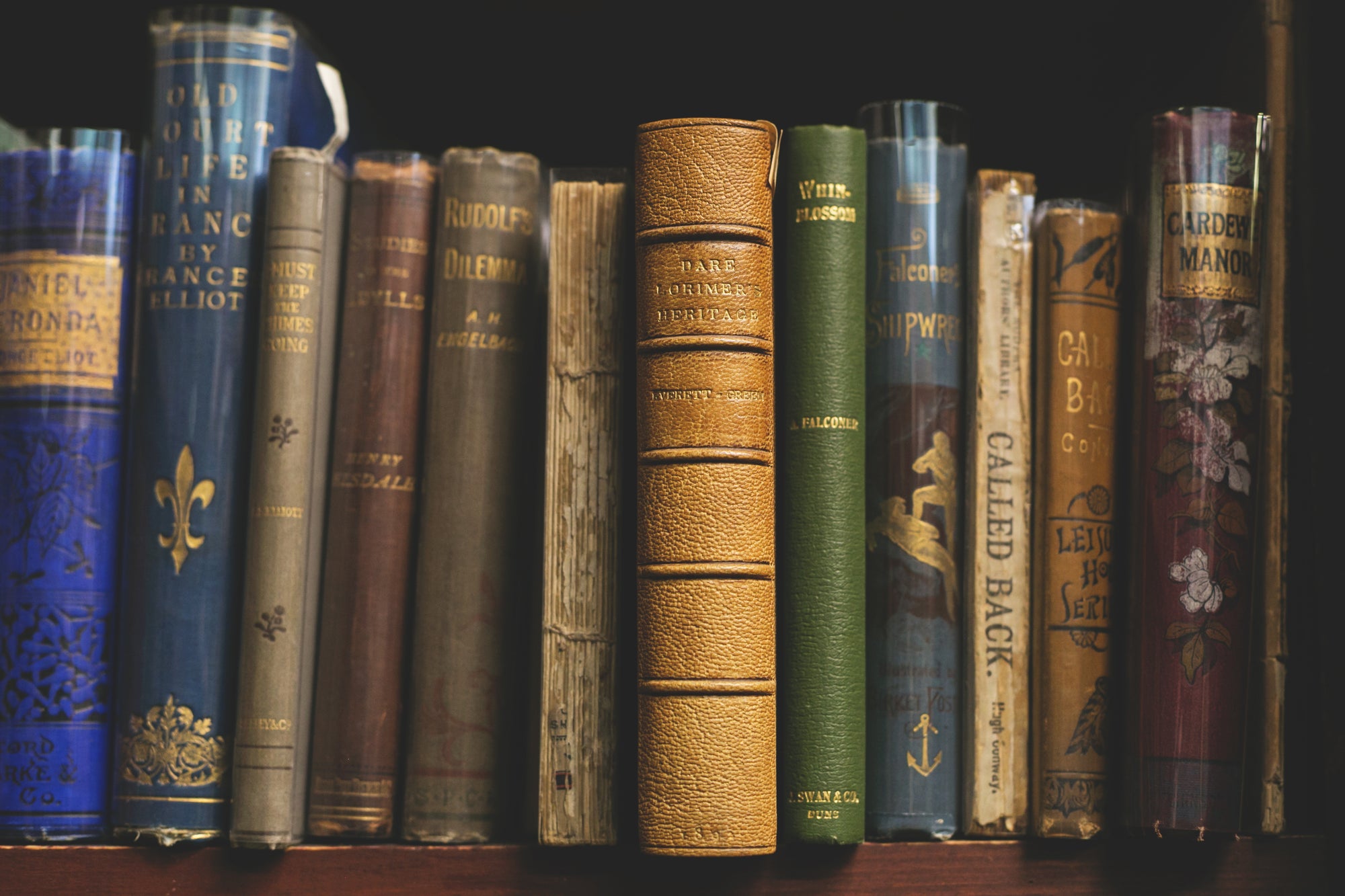 Image. A shelf filled with old books.